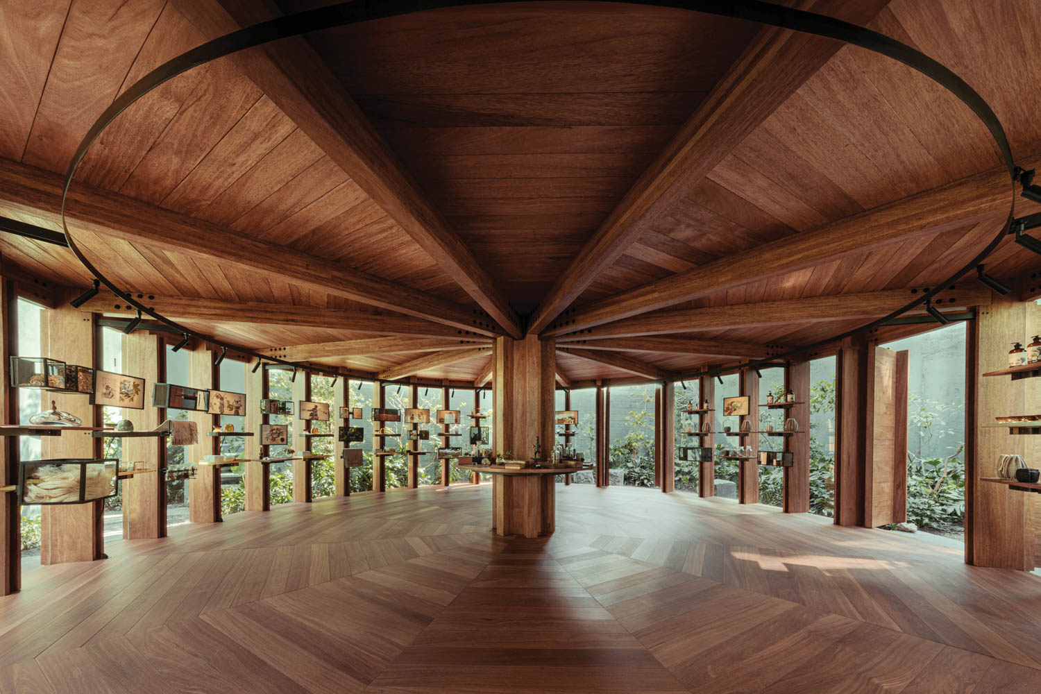 retail store interior design with wooden ceilings and floors with screens and shelves all around